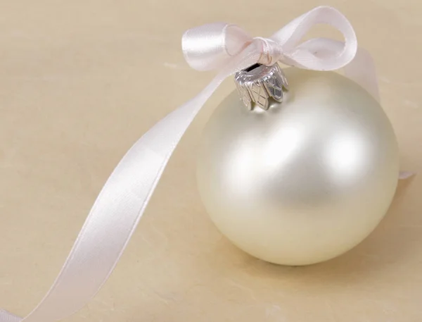 White christmas ball , isolated on beige background — Stock Photo, Image