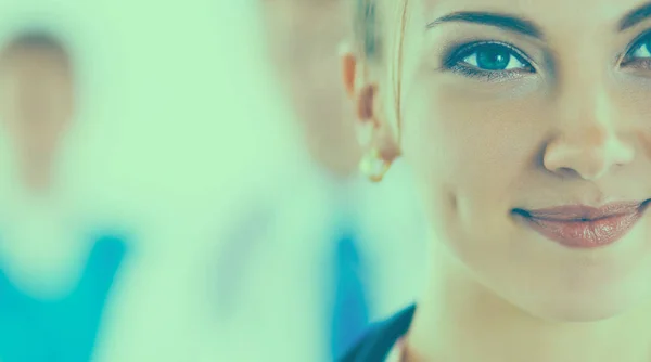 Attractive female doctor in front of medical group — Stock Photo, Image