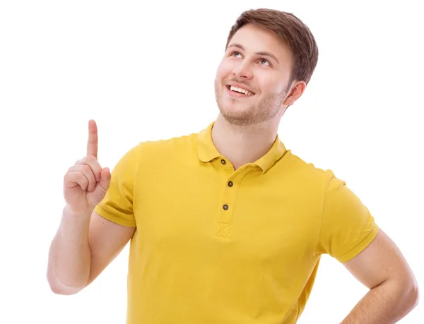 Portret van een jonge man die lacht zittend op grijze achtergrond — Stockfoto