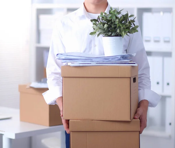 Portrait of a person with moving box and other stuff isolated on white — Stock Photo, Image