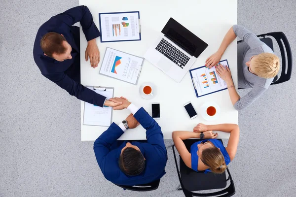 Business people sitting and discussing at meeting, in office — Stock Photo, Image