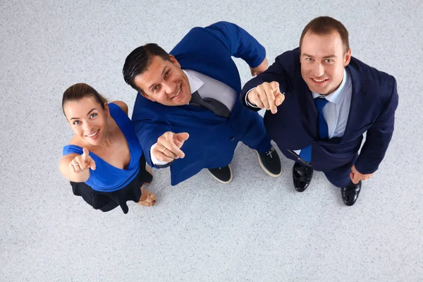 Empresários de pé juntos apontando para você — Fotografia de Stock