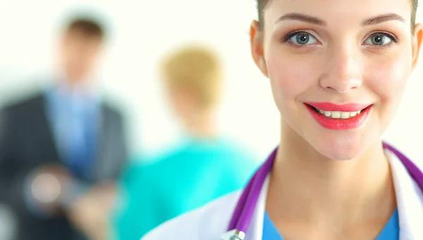 Woman doctor standing with stethoscope at hospital — Stock Photo, Image