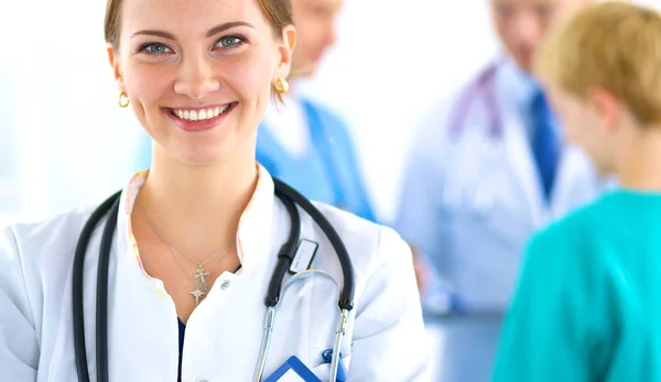 Woman doctor standing with stethoscope at hospital — Stock Photo, Image