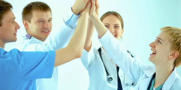 Doctors and nurses in a medical team stacking hands — Stock Photo, Image