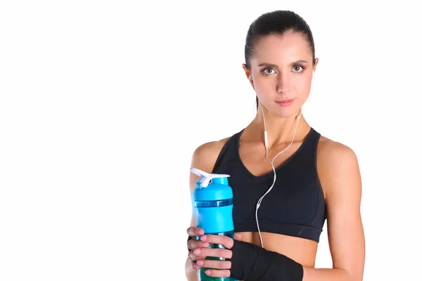 Fille avec bouteille dans les mains après le sport — Photo