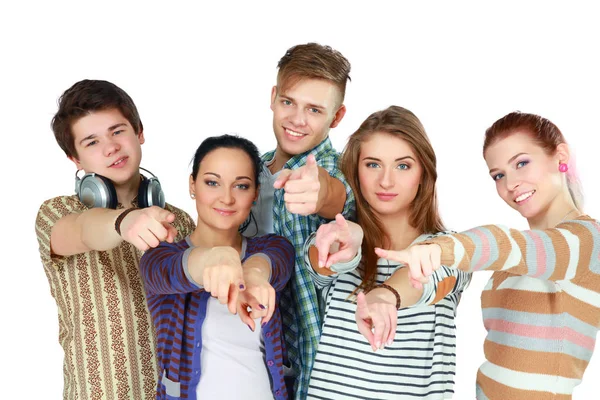 Group of happy students pointing at you . Isolated over white background — Stock Photo, Image