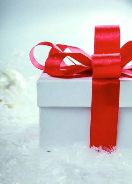 White gift box with red ribbon and bow — Stock Photo, Image