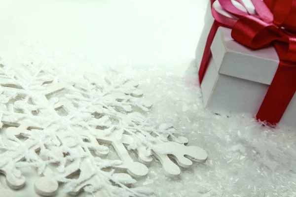 White gift box with red ribbon and bow — Stock Photo, Image