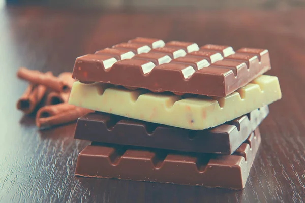 Mix of chocolate pieces on table, close-up — Stock Photo, Image