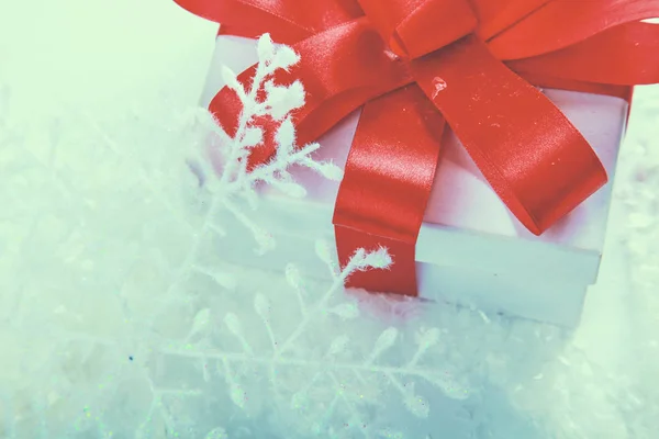 White gift box with red ribbon and bow — Stock Photo, Image