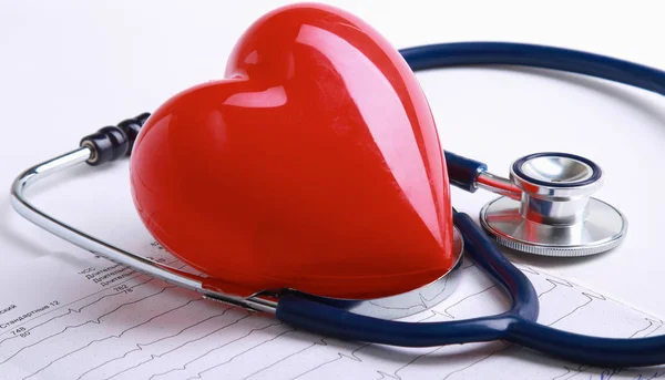 Red heart and a stethoscope on desk — Stock Photo, Image