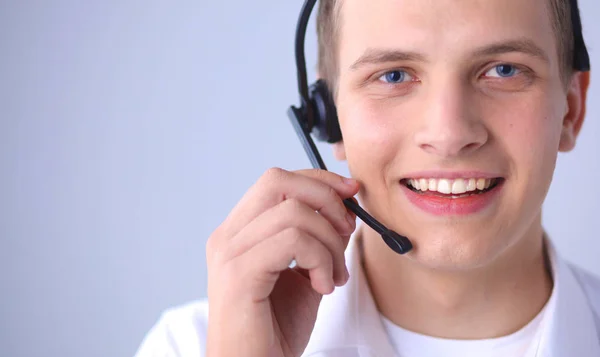 Customer support operator with a headset on white background — Stock Photo, Image