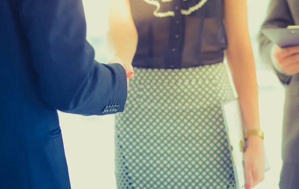 Businesswoman Shaking Hands In Office — Stock Photo, Image