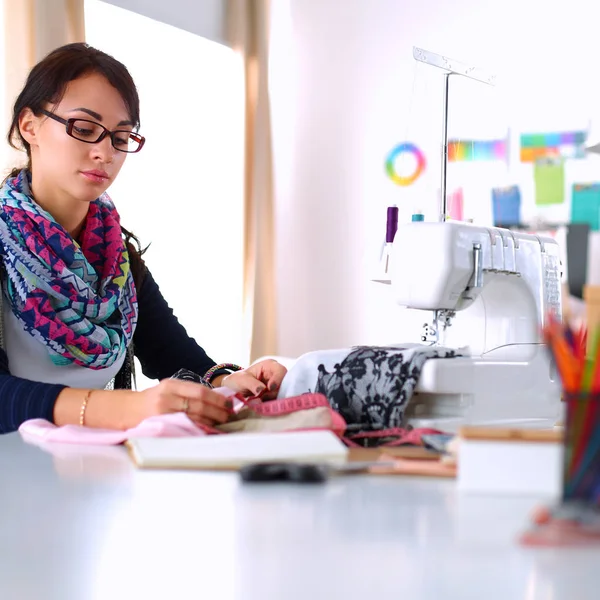 Dressmaker designing clothes pattern on paper — Stock Photo, Image