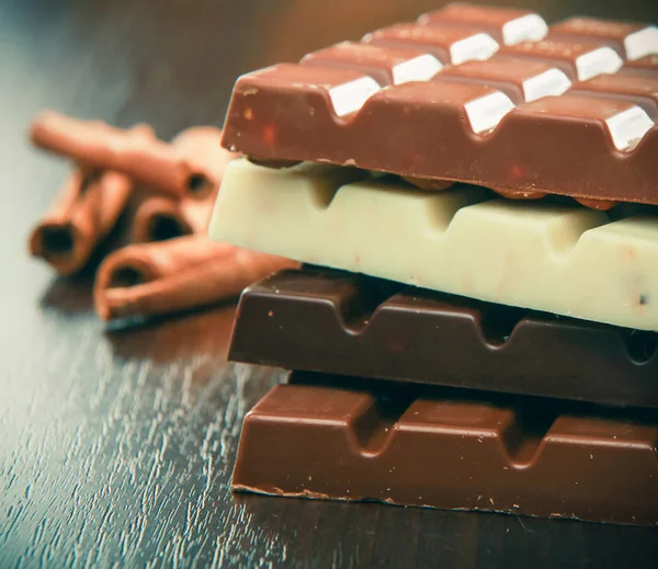 Mix of chocolate pieces on table, close-up — Stock Photo, Image