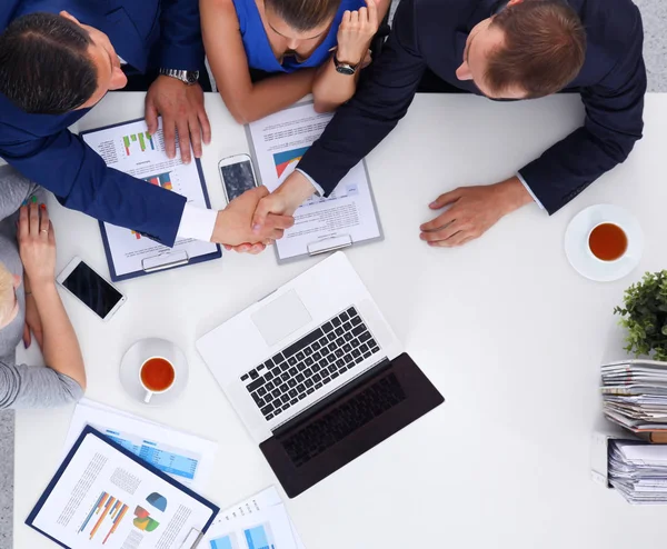 Business people sitting and discussing at meeting, in office. — Stock Photo, Image