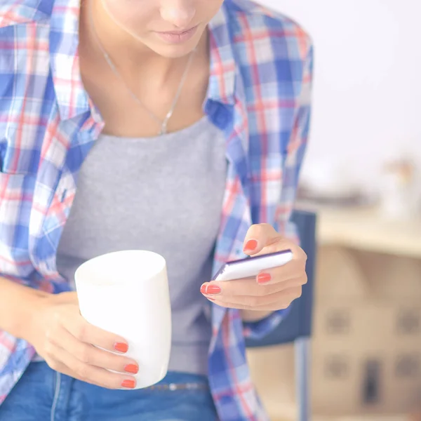 Young woman reading mgazine In kitchen at home — Stock Photo, Image