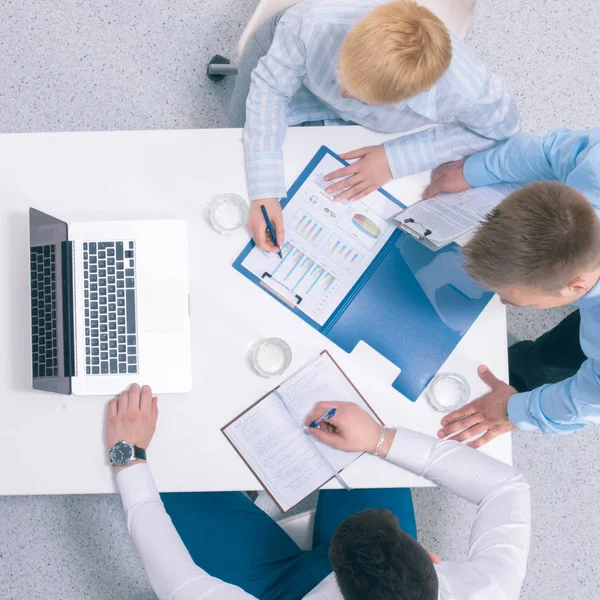 Business people sitting and discussing at business meeting, in office — Stock Photo, Image