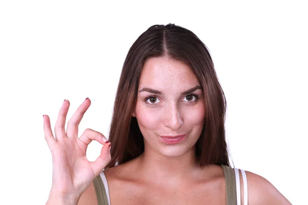 Happy young woman showing ok sign with fingers — Stock Photo, Image