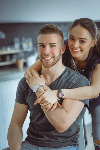 Beautiful young couple is having fun in kitchen at home — Stock Photo, Image