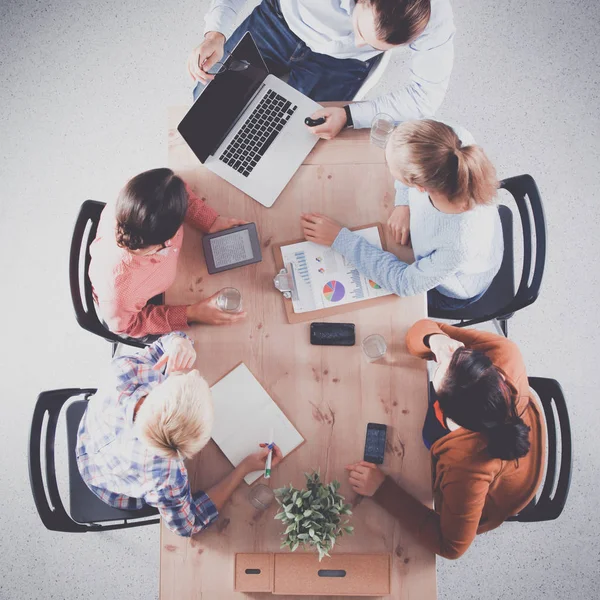 Business people sitting and discussing at meeting, in office — Stock Photo, Image