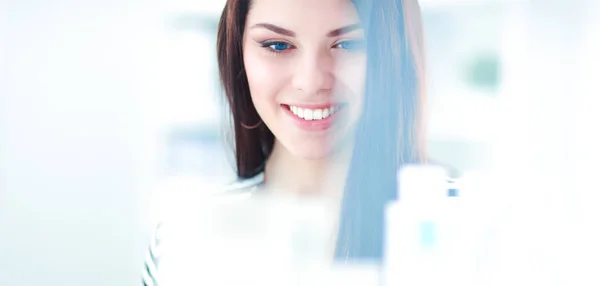 Beautiful young woman in shop — Stock Photo, Image