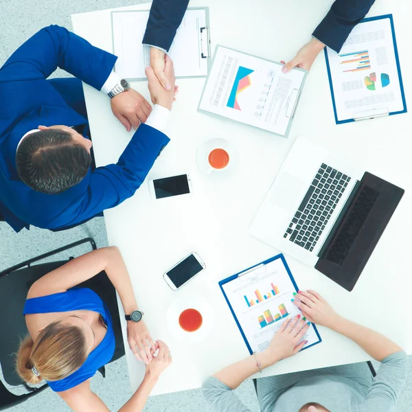 Business people sitting and discussing at meeting, in office — Stock Photo, Image