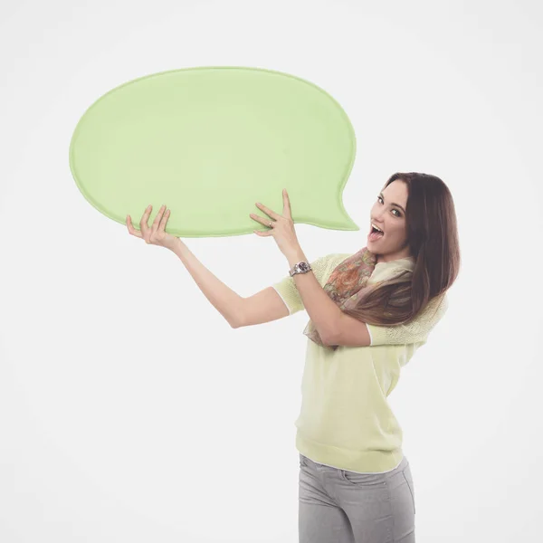 Portret van een toevallige jonge vrouw met lege kaart - op witte achtergrond. — Stockfoto