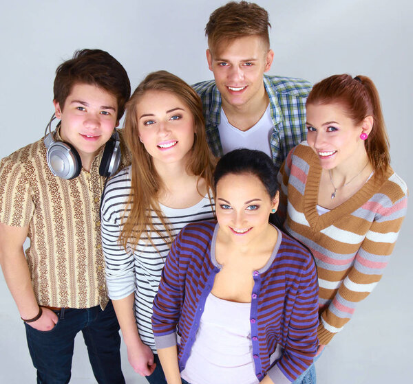 Group of happy students. Isolated over white background.