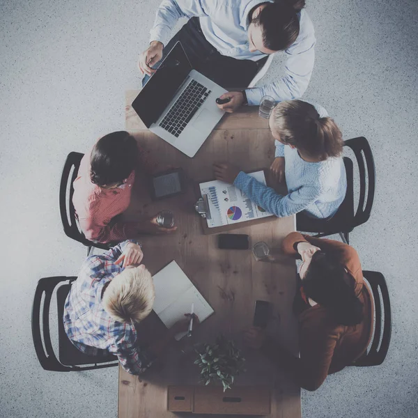 Business people sitting and discussing at meeting, in office — Stock Photo, Image