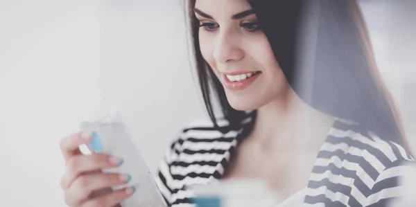 Beautiful young woman in shop — Stock Photo, Image