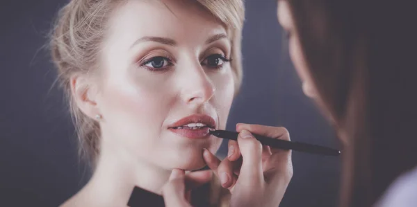 Artist doing professional make up of woman — Stock Photo, Image