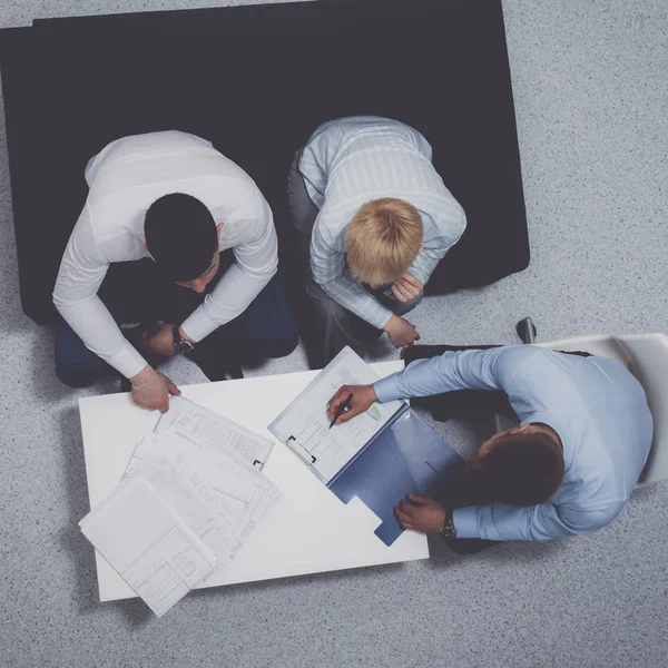 Business people sitting and discussing at business meeting, in office — Stock Photo, Image