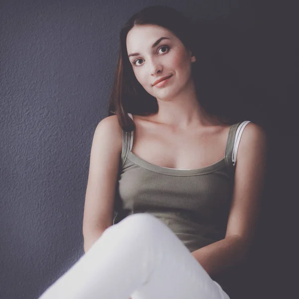 Attractive caucasian girl sitting on floor — Stock Photo, Image