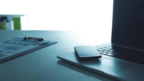 Modern home office with computer and laptop, folder, phone lying on the desk — Stock Photo, Image