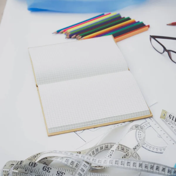 Designers table with blank note and tools ,glasses — Stock Photo, Image