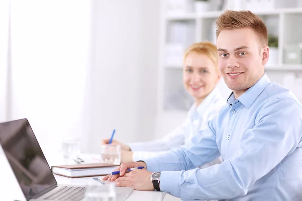 Attractive female doctor in front of medical group — Stock Photo, Image