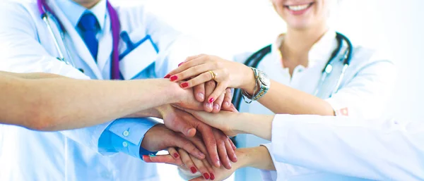 Doctors and nurses in a medical team stacking hands — Stock Photo, Image