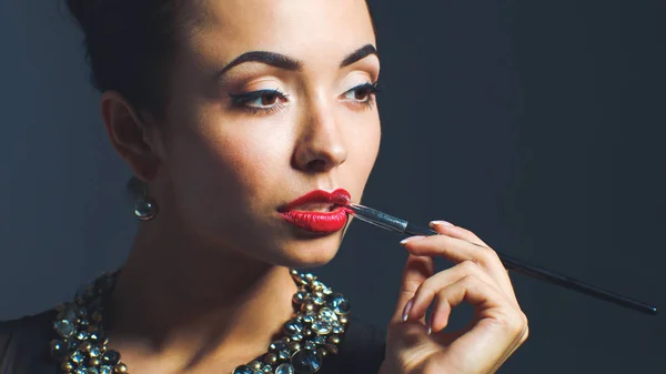 Portrait of young beautiful woman with jewelry — Stock Photo, Image