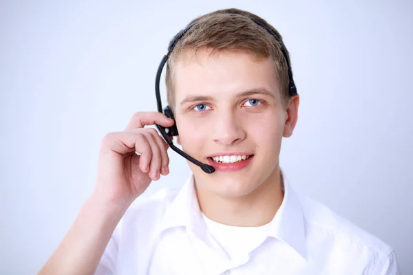 Operador de atención al cliente con auriculares sobre fondo blanco — Foto de Stock