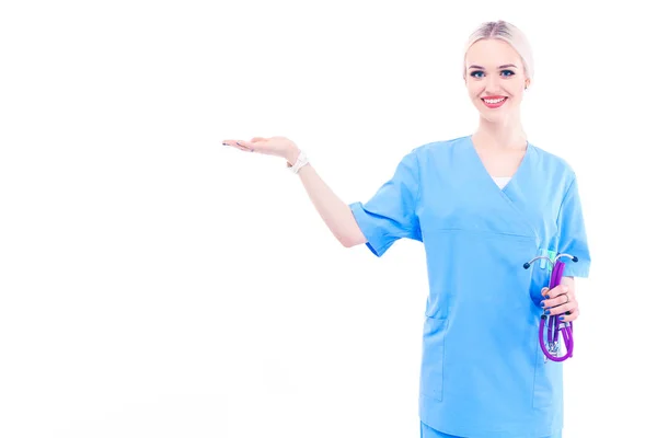 A portrait of a female doctor pointing, close-up, isolated on white background. Woman doctor — Stock Photo, Image