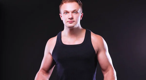 Handsome muscular man working out with dumbbells — Stock Photo, Image