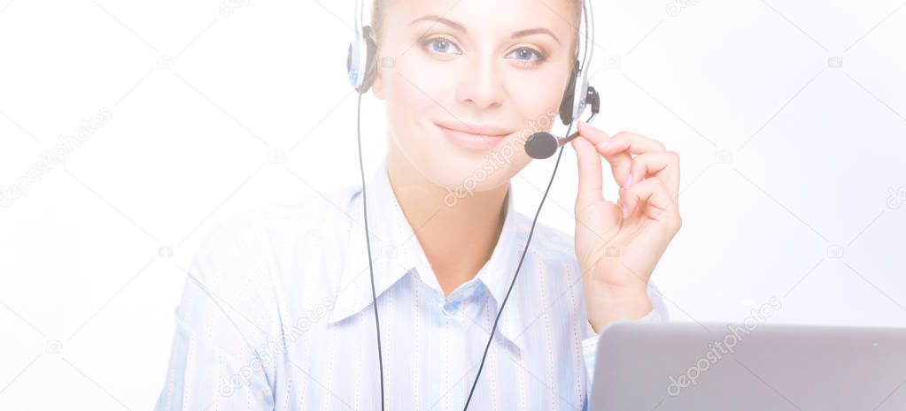 Portrait of beautiful business woman working at her desk with headset and laptop