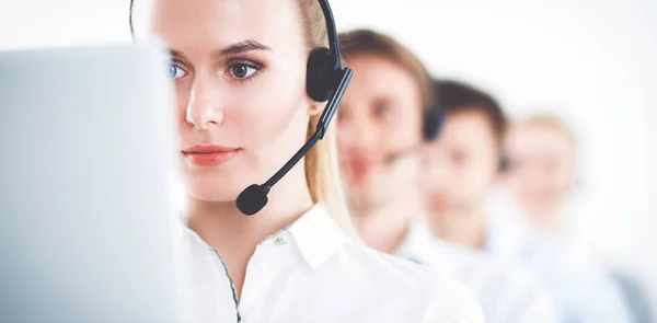 Attractive positive young businesspeople and colleagues in a call center office — Stock Photo, Image