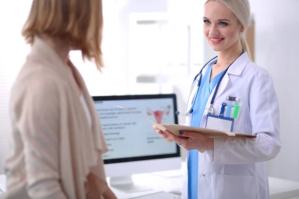 Doctor and patient discussing something while sitting at the table . Medicine and health care concept. Doctor and patient — Stock Photo, Image