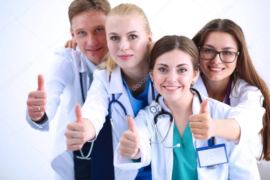 Portrait of group of smiling hospital colleagues standing together . Doctors