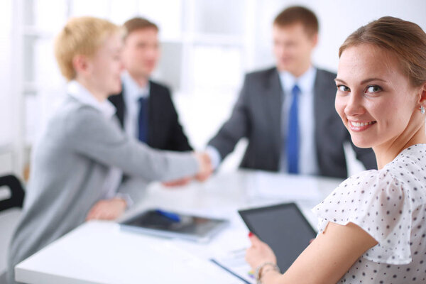 Business handshake. Business people shaking hands, finishing up a meeting.