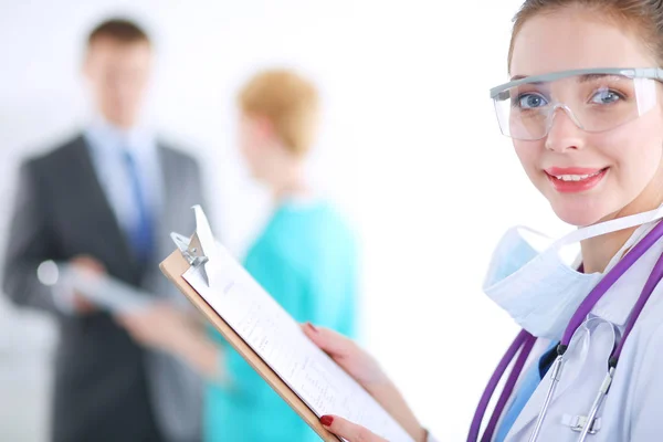 Woman doctor standing with folder at hospital. Woman doctor — Stock Photo, Image