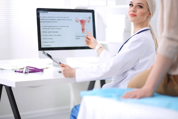 Doctor and patient discussing something while sitting at the table . Medicine and health care concept. Doctor and patient — Stock Photo, Image